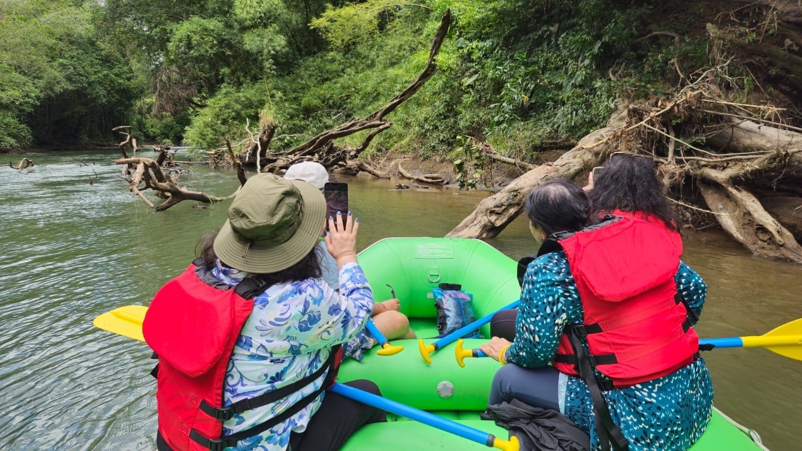 Guests on the safari float along the Peñas Blancas river